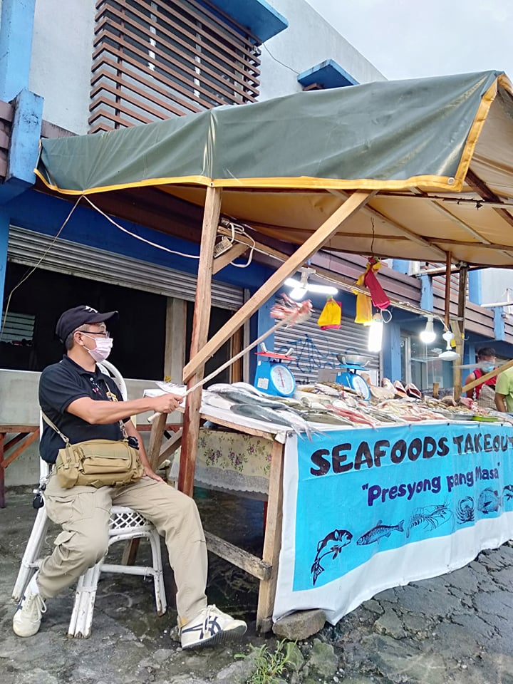 Ben takes duty over a seafood stall owned by his brother. | Photo from personal collection, courtesy of Ben Machon