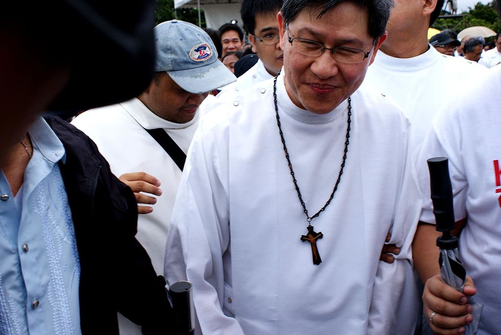 "Cardinal Luis Tagle making a suprise appearance at the Million People March protest held in Luneta." by James Sarmiento is licensed under CC BY 2.0