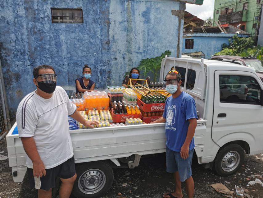 Just a couple of months after returning home, Carlos Manzano and his family was able to set up their business as Coca-Cola distributor through the Balik Pinas Program, which Carlos said has reshaped his life and outlook forever. IN PHOTO: Carlos and their family’s multi-cab routing unit with the Coca-Cola Naga Sales team.