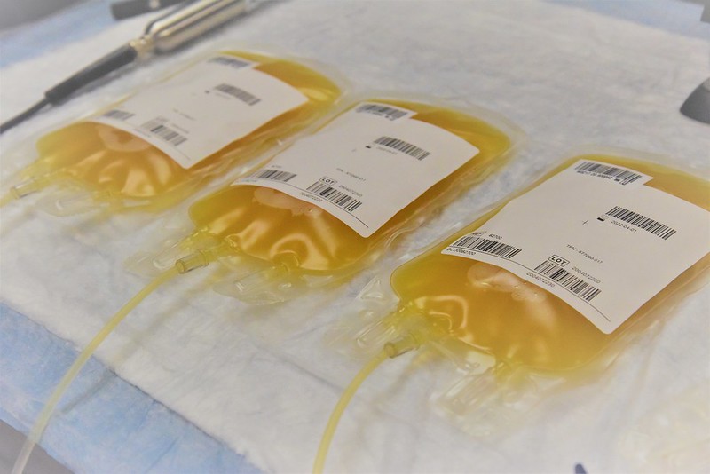 "200602-N-LL896-0019. Plasma collected by staff at U.S. Naval Hospital Guam from Sailors who have recovered from COVID-19. (U.S. Navy Photo by Jaciyn Matanane/Released)" by Navy Medicine, Defense Visual Information Distribution Service is in the Public Domain