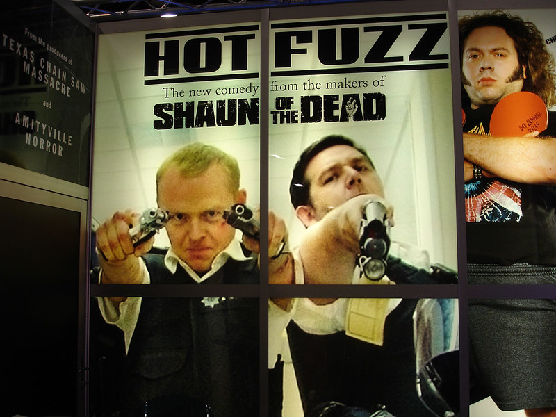 "Comic-Con 2006 - Hot Fuzz banner at the Rogue pictures booth" by The Pop Culture Geek Network is licensed under CC BY-NC 2.0