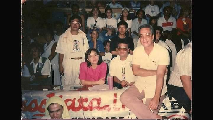 post-dictatorship abs-cbn host, local journo passes on 2 Nick Lizarea, standing with media vest, with ABS CBN Bacolod talents, among them Rodolfo Alvarez (right) , the first host of Pulso Sa Kwatro, and Harold Limbo seated next to Alvarez. | Photo courtesy of Harold Limbo used with permission