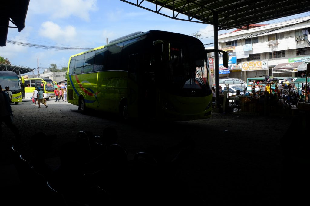A Ceres bus from southern Negros enters the southern bus terminal at Lopez Jaena Street in Bacolod City. Like the bus shown here entering the shade, the saga of the Yanson's business empire is entering a dark place as the intra-corporate conflict continues to rage. | Photo by Jose Aaron C. Abinosa
