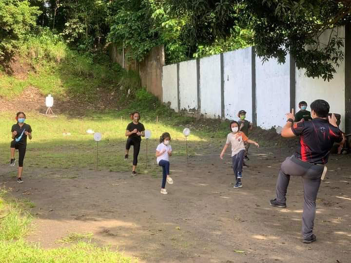 Former Army Capt. Jose Carlos Coruña teaching kids self defense and gun skills at the NIR Shooting Range at the Sta. Fe Resort in Granada village, Bacolod City. | Photo from NIR Shooting Range Facebook page