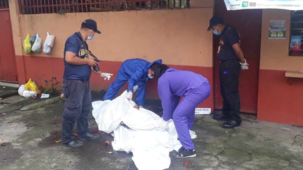 SOCO team investigates the scene of the crime at Barangay 32.