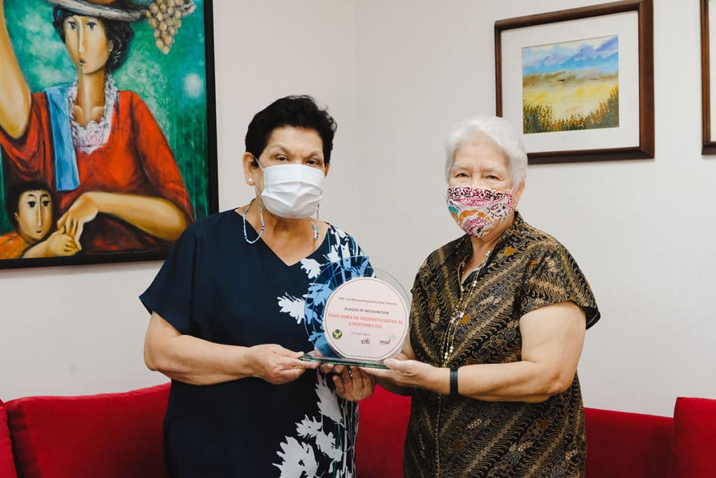 NWTF founders--- Ms. Suzzette Gaston and Ms. Corazon Henares accept the plaque of recognition on behalf of the organization. | Photo by NWTF.