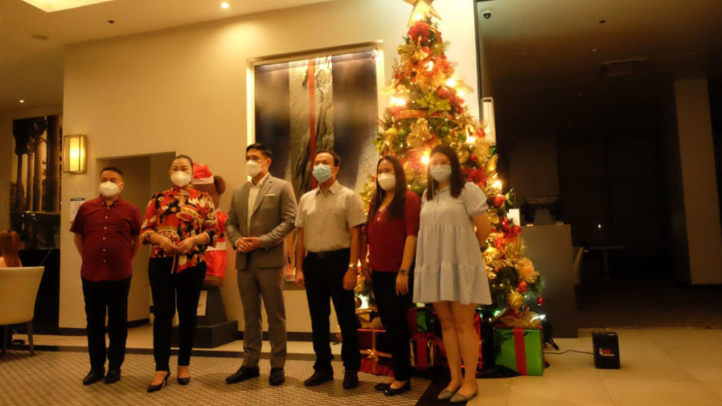 Emergency Operations Center director Em Ang, businessman Ed Guillem and village 18 chief Jonathan Diaz attended the virtual Christmas Tree lighting along with Seda Hotel Manager Kim Joseph Guimba.  | Photo by Kyle Jocson