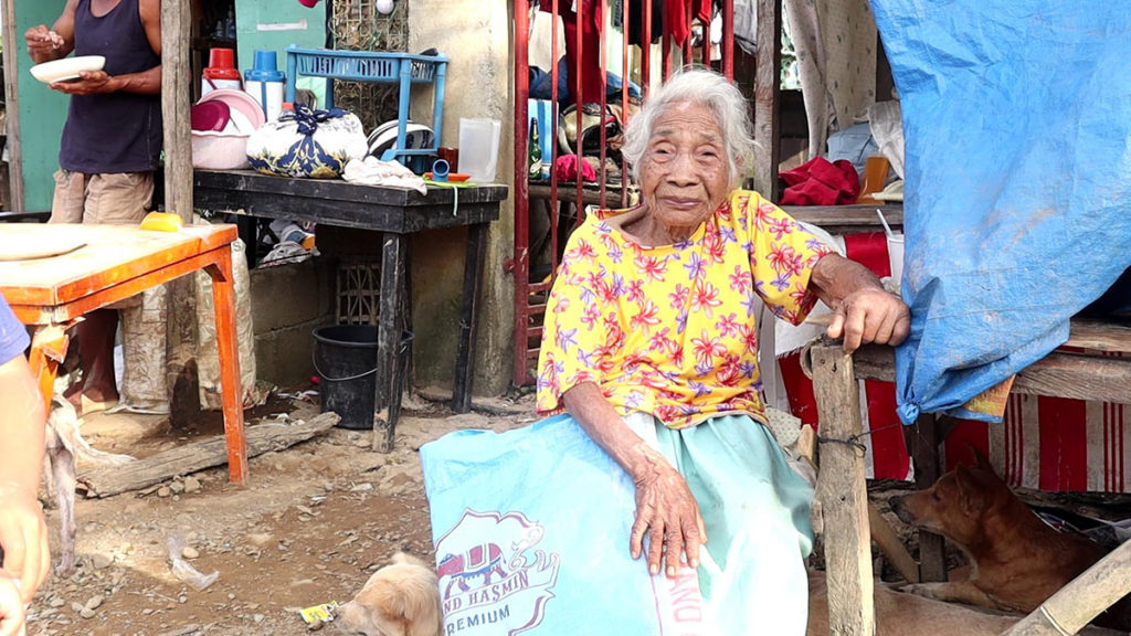 CHEATING DEATH. Carmelina Batubatan, 82, thought she will die when Typhoon Odette hit them in Gil Montilla village in Sipalay City. She recalls her old age and weak legs made it difficult for her to evacuate. | Photo by Nikki Magbanua