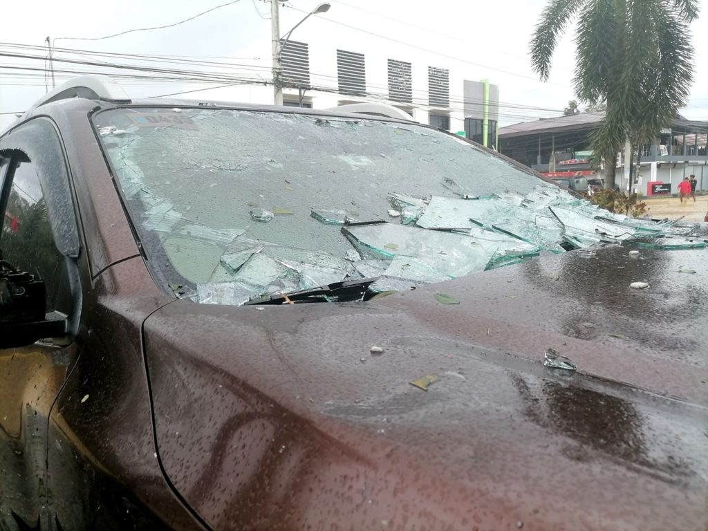 Photo shows the damaged car of the DNX coverage team that got hit by flying shards of glass when the storm made landfall.