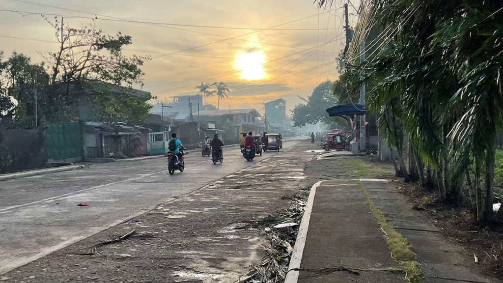 Photo by Ralph Justin Gestosani shows traffic returning to the streets in Binalbagan town after Typhoon Odette made landfall in southern Negros Occidental.
