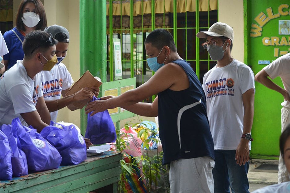 Student volunteers facilitating the distribution of relief goods.