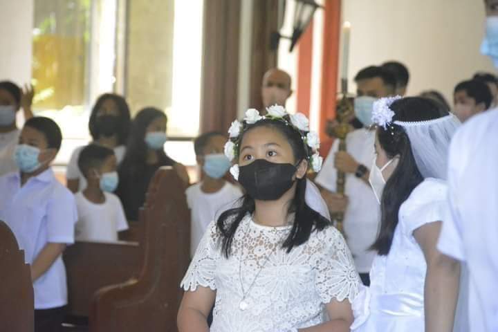 First Communion. Youngsters line up inside a Roman Catholic church to receive their First Communion after undergoing Cathechism. | Photo courtesy of Althea Rose Mauricio used with permission