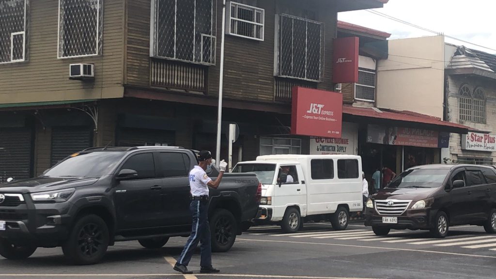 Antonio Cordero on a busy day as a traffic enforcer at the intersection of Lacson and Rosario Streets. | Photo by Mira Nicole Magbanua.