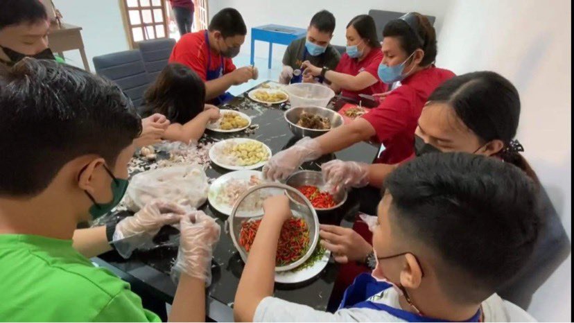 The Transition Class busy preparing ingredients of their bottled spiced vinegar.