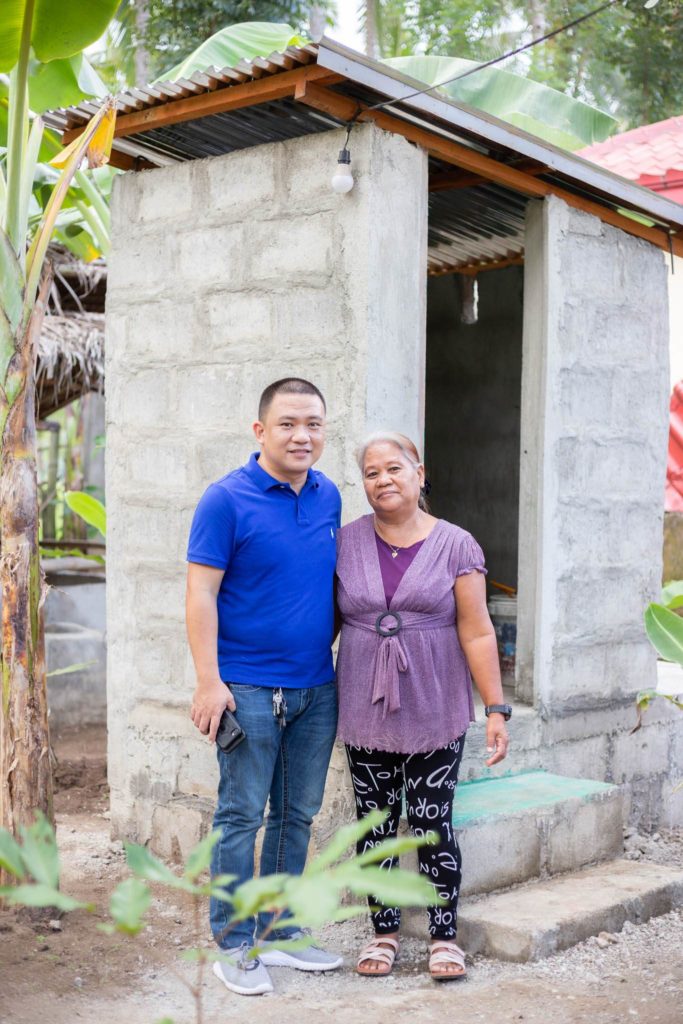 Cauayan Mayor John Rey Tabujara with Lorena, one of Output-Based Aid – Blended Finance project beneficiaries