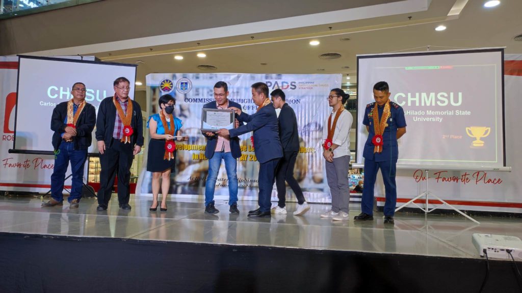 CHMSU NSTP and DRRMO Director Elmer A. Gumban, PhD, receives the Certificate of Recognition behalf of the university.