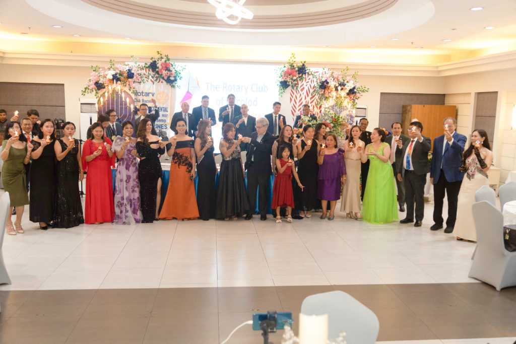 The newly-elected officers and members of the Rotary Club of Bacolod, with Mr. Myles Joseph Sotelo and visiting Rotarians, at their 86th Charter Anniversary and 84th Turnover & Induction ceremony recently.