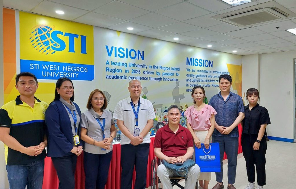 (L-R) Dr. Enju Juanda, S.H, M.H (standing) of Galuh University, Indonesia and Dr. Mima Villanueva, VP for Academic Affairs of STIWNU Bacolod holding the memorandum of agreement after the signing of the MOA via Zoom on July 10. The ceremony was witnessed by Evi Noviawati, SH. MH, Vice Dean for Academic Affairs, and Alis Yulia, SH. MH, Vice Dean for Finance of GU and Dr. Maria Teresa Asistido, Director for External Affairs & Linkages, Anamor Jerez, MBA Program Head, Christy Mae Rioja, Bachelor of Science in Accountancy Program Head, and Dr. Yasmin Pascual-Dormido of the Master in Public Administration and Doctor in Public Administration Programs of the School of Graduate Studies of STWNU.