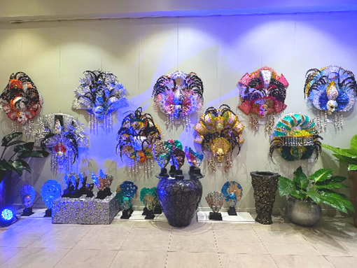 Festive Faces exhibit featuring 14 exclusive designs from artist, Jojo Vito