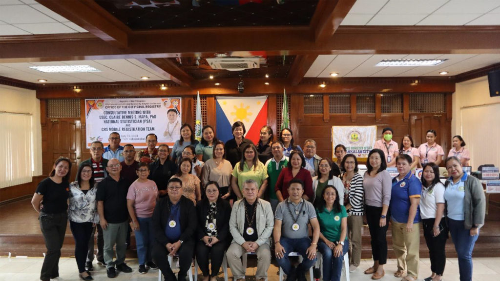 The Provincial Association of Civil Registrars in Negros Occidental, Inc. poses for a picture with, from left to right, Chief Statistical Specialist John F. Campomanes, Assistant National Statistician Marizza B. Grande, Undersecretary Claire Dennis S. Mapa, and Mayor Benjie M. Miranda.