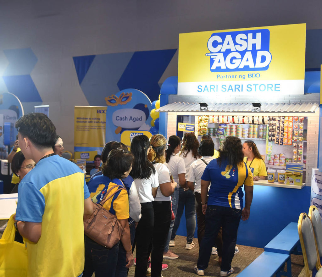 Your friendly neighborhood Automated Tao Machine. Clients line up to play games in the Cash Agad booth during the BDO Fiesta.