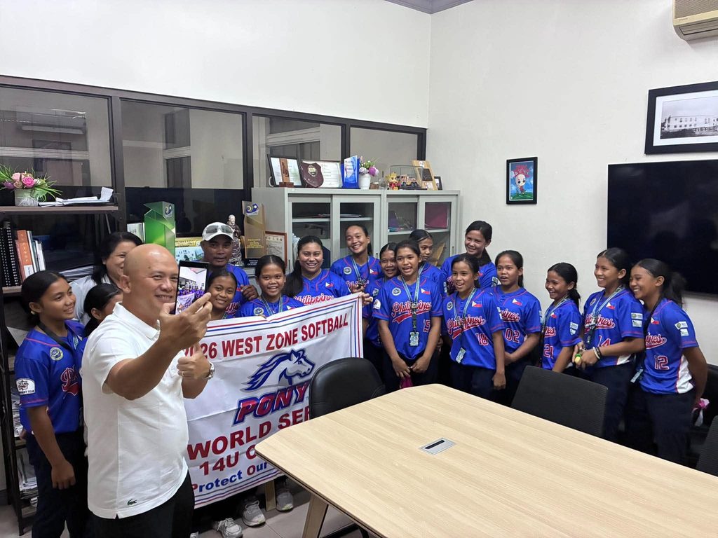 SELFIE WITH THE CHAMPS | Provincial Administrator Atty. Rayfrando Diaz (foreground, left) snaps a selfie with Murcia Open Bible Christian Academy's 14-and-under softball team and their 2026 West Zone Softball PONY World Series banner at the Negros Occidental Provincial Capitol on Sept. 23. During the visit, Diaz said the Panaad sports facility will soon be ready to serve Negros Occidental athletes as a place where they can continue training. The players brought the title home from Hemet, California, after winning all five of their games.